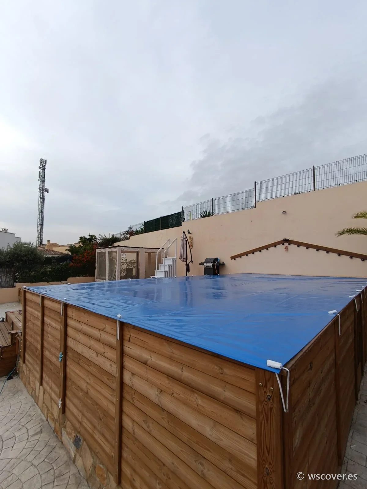 Winter PVC cover on a raised timber pool