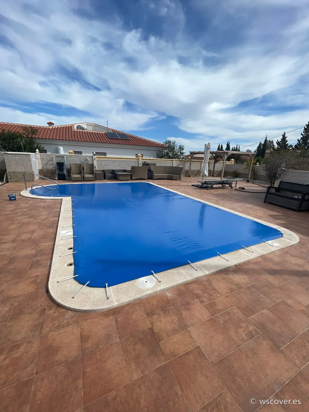 Winter PVC cover on an L-shaped pool