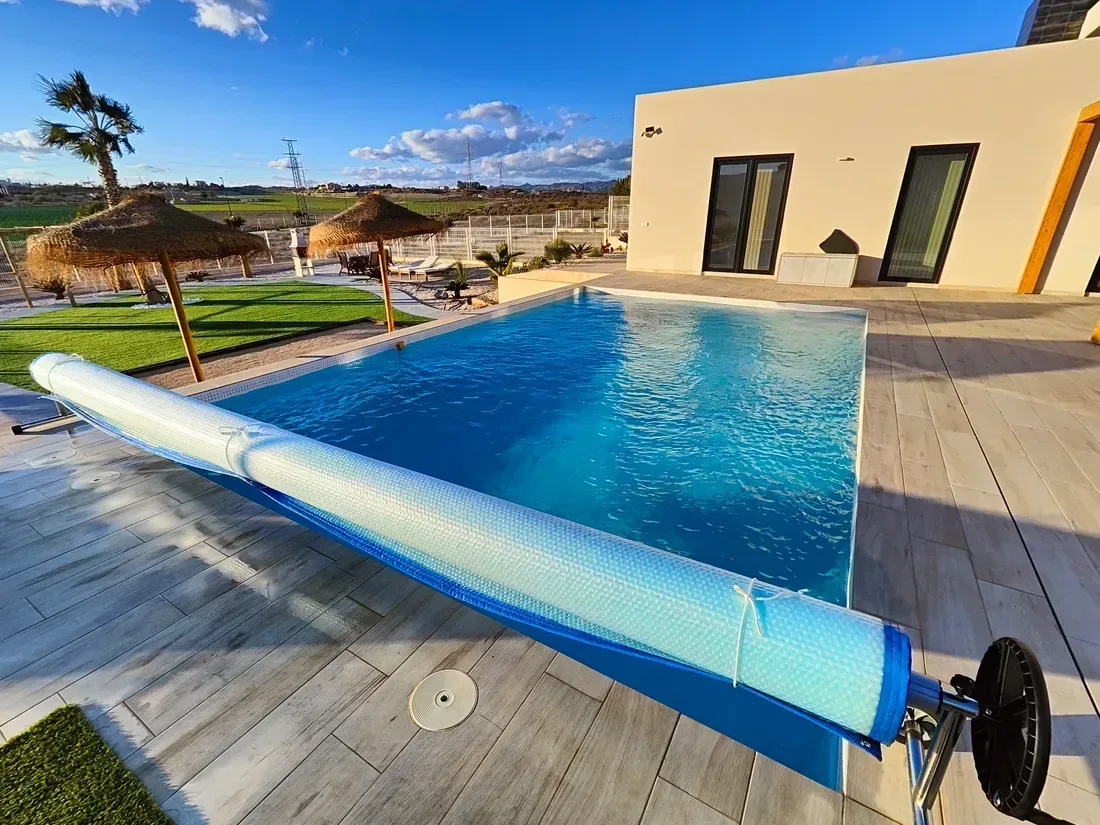 Bubble pool cover installed by WS Cover at sunset